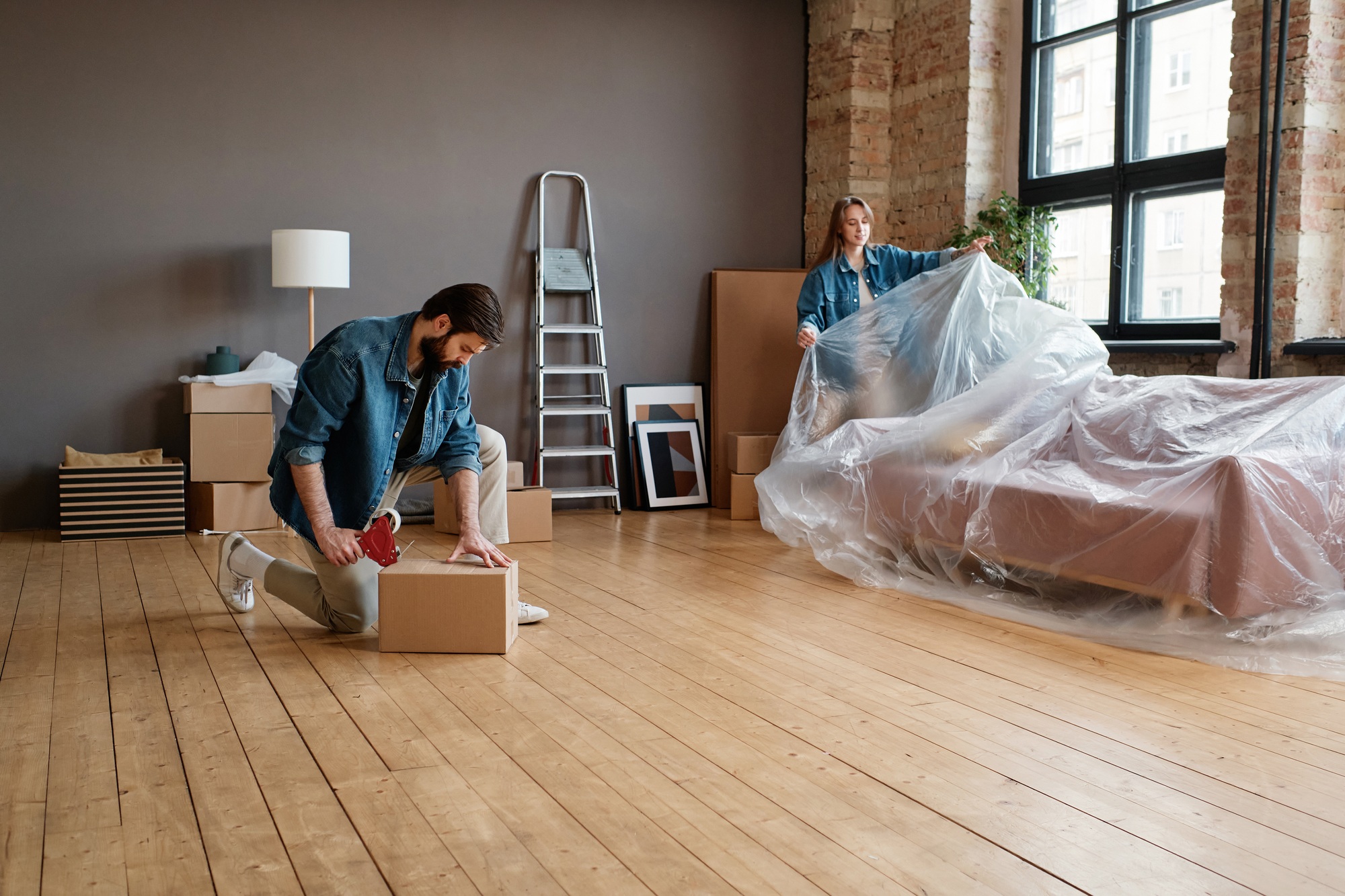 Couple Packing Furniture And Various Things