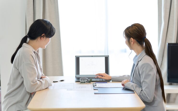Female salesperson providing real estate information