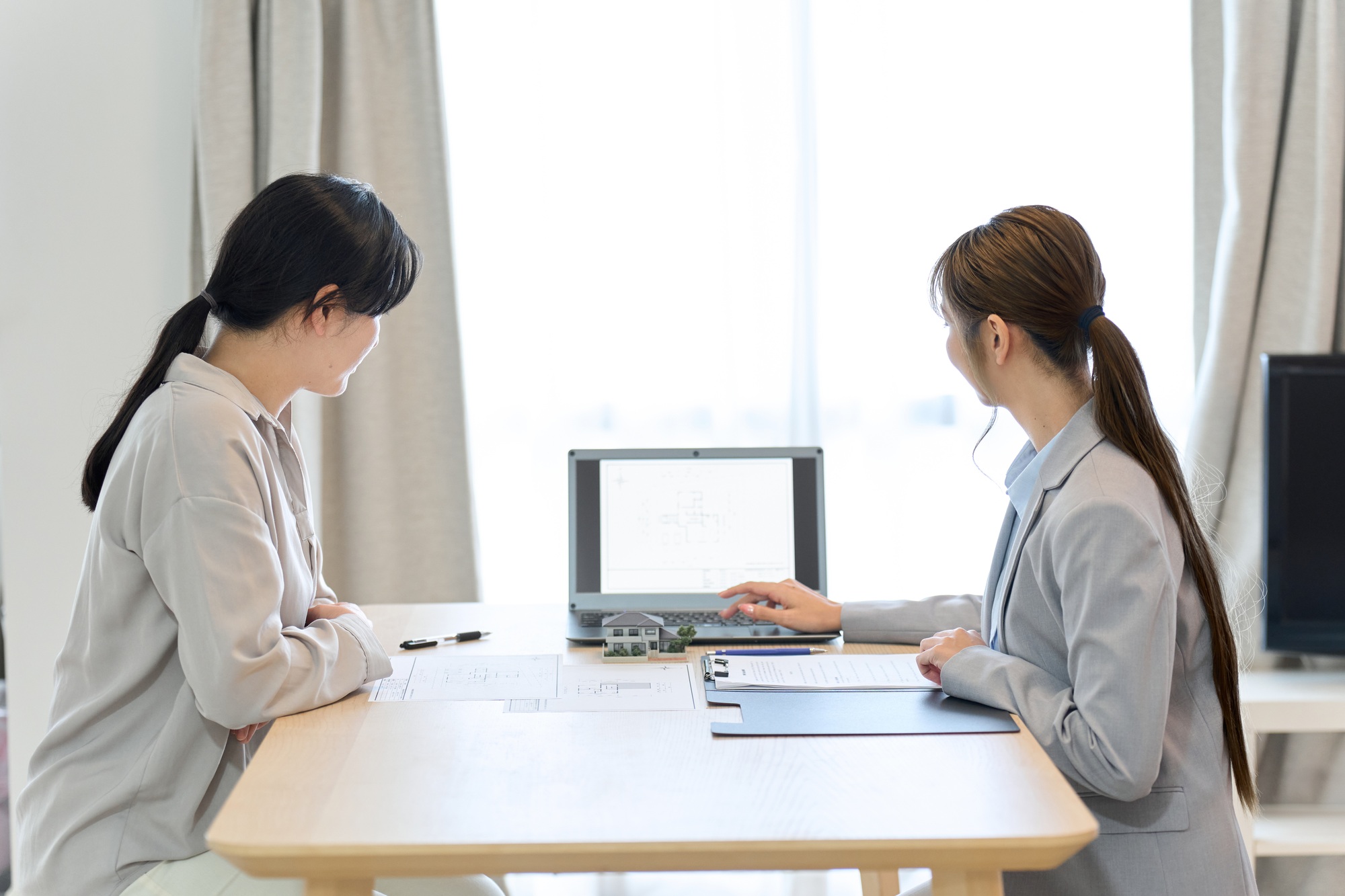 Female salesperson providing real estate information